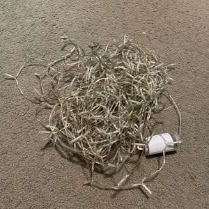 Fairy lights, beads and marbles, glass vase